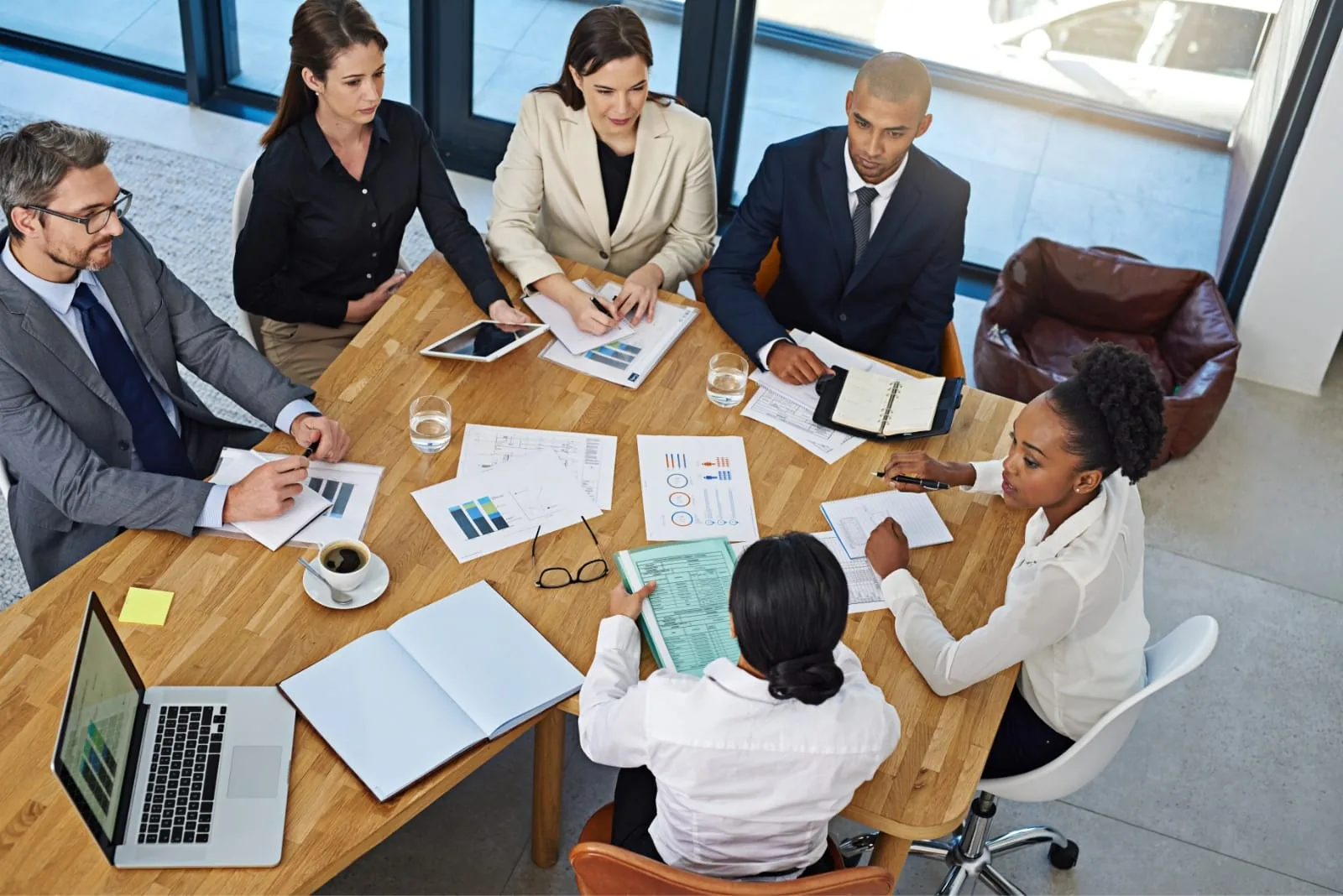 Audit team reviewing financial documents around a table